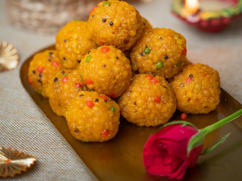 Fresh laddoos with a diya
